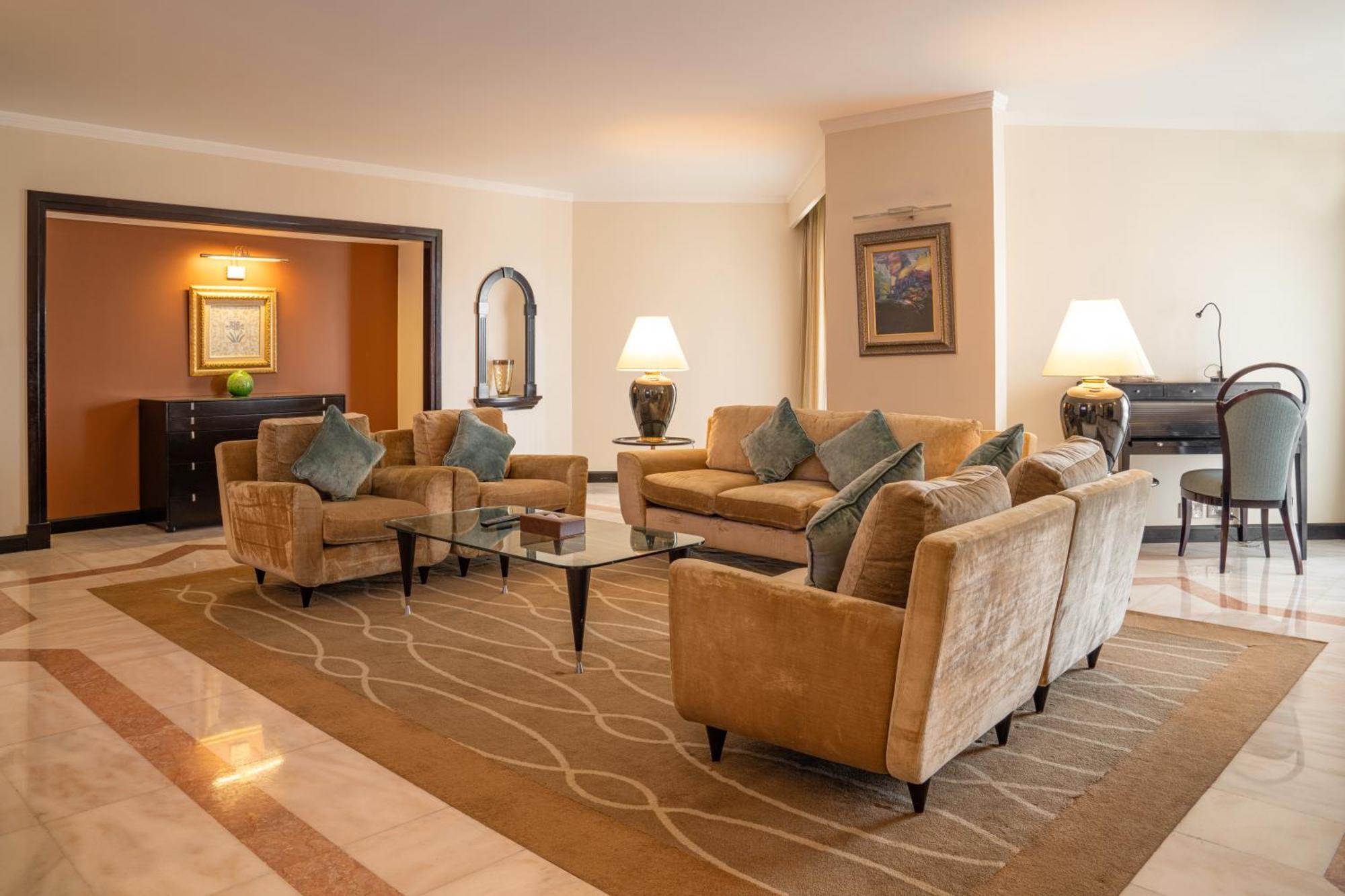 Danat Al Ain Resort Экстерьер фото A living room in a suite at the Jumeirah Emirates Towers Hotel