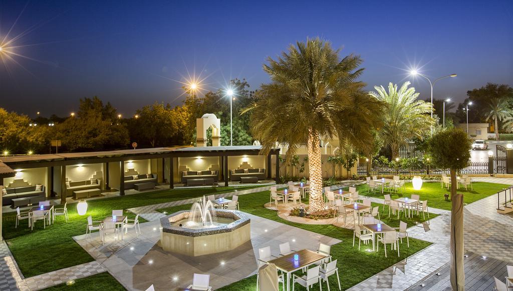 Danat Al Ain Resort Экстерьер фото The park at night